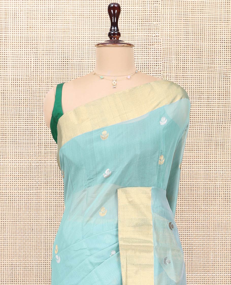Blue Chanderi Cotton Saree, Gleamed Up with Floral Buttas All Over Its Body, Highlighted by a Bavanji Border, Pallu Steeped with Zari Stripes, and Paired with a Matching Blouse