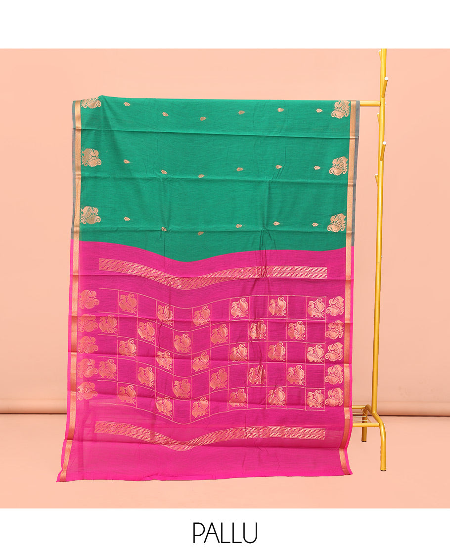 Green Semi-Silk Cotton Saree, Beautified with Buttas and Peacock Buttas All Over Its Body, a Subtle Zari Piping Border, Pallu of Peacock Butta Enclosed Checked Design, and Paired with a Contrast Blouse