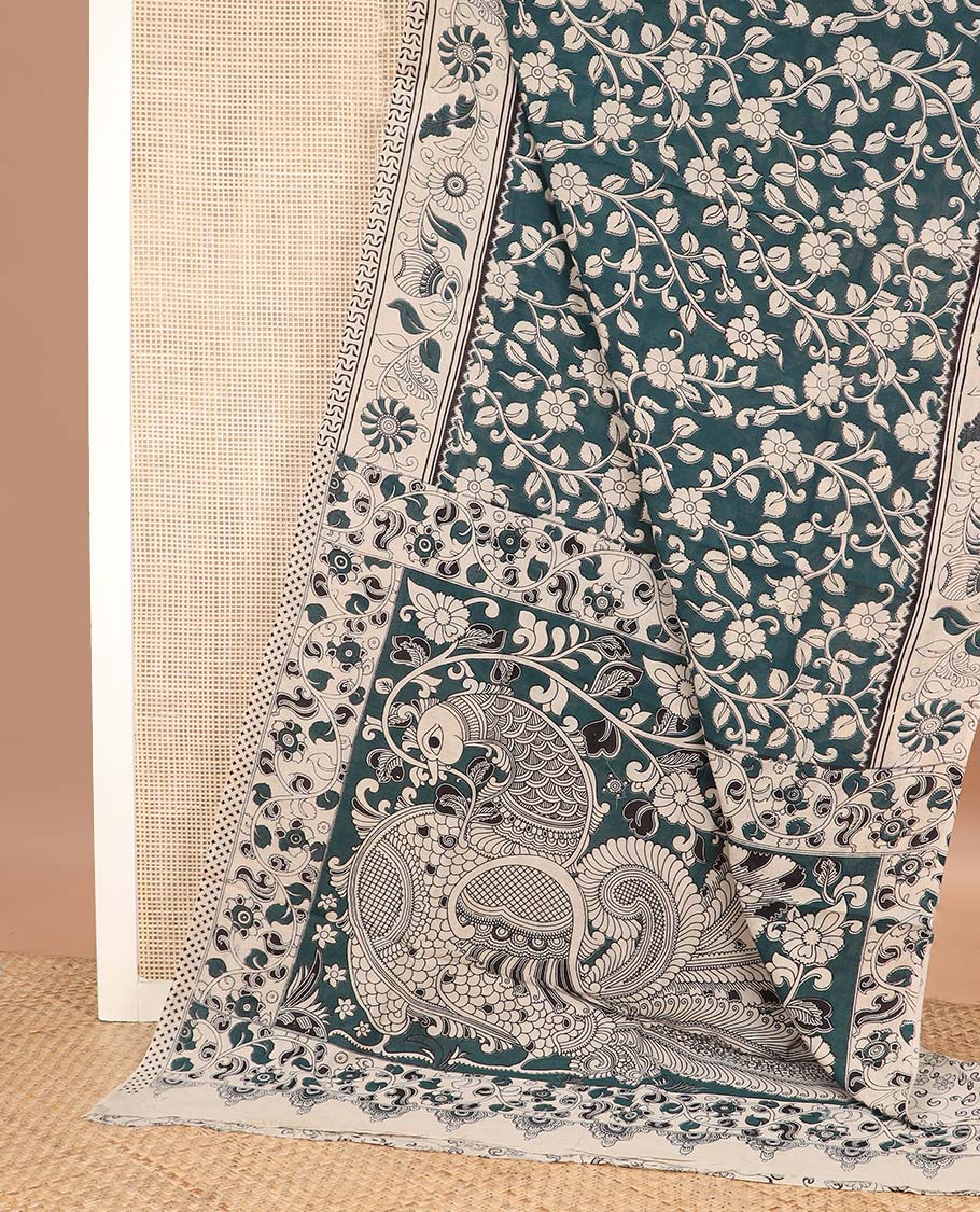 Teal blue floral vine machine printed kalamkari cotton saree, contrast floral-peacock border, and pallu of peacocks print