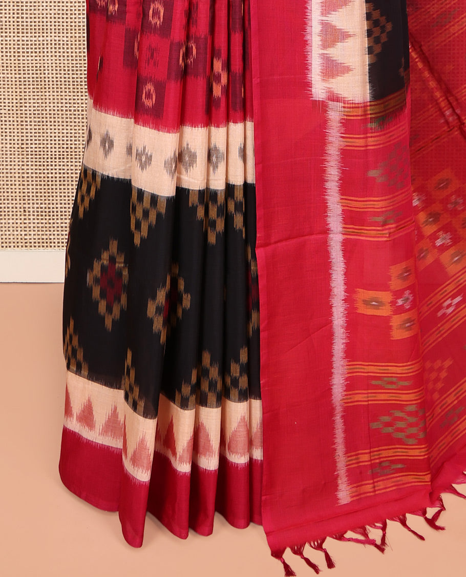 Black Ikkat Cotton Saree, Ornamented with Ikkat-style Buttas All Over Its Body, Complemented by a Contrast Temple Border, Pallu of Geometric Patterns, and Paired with a Contrast Blouse