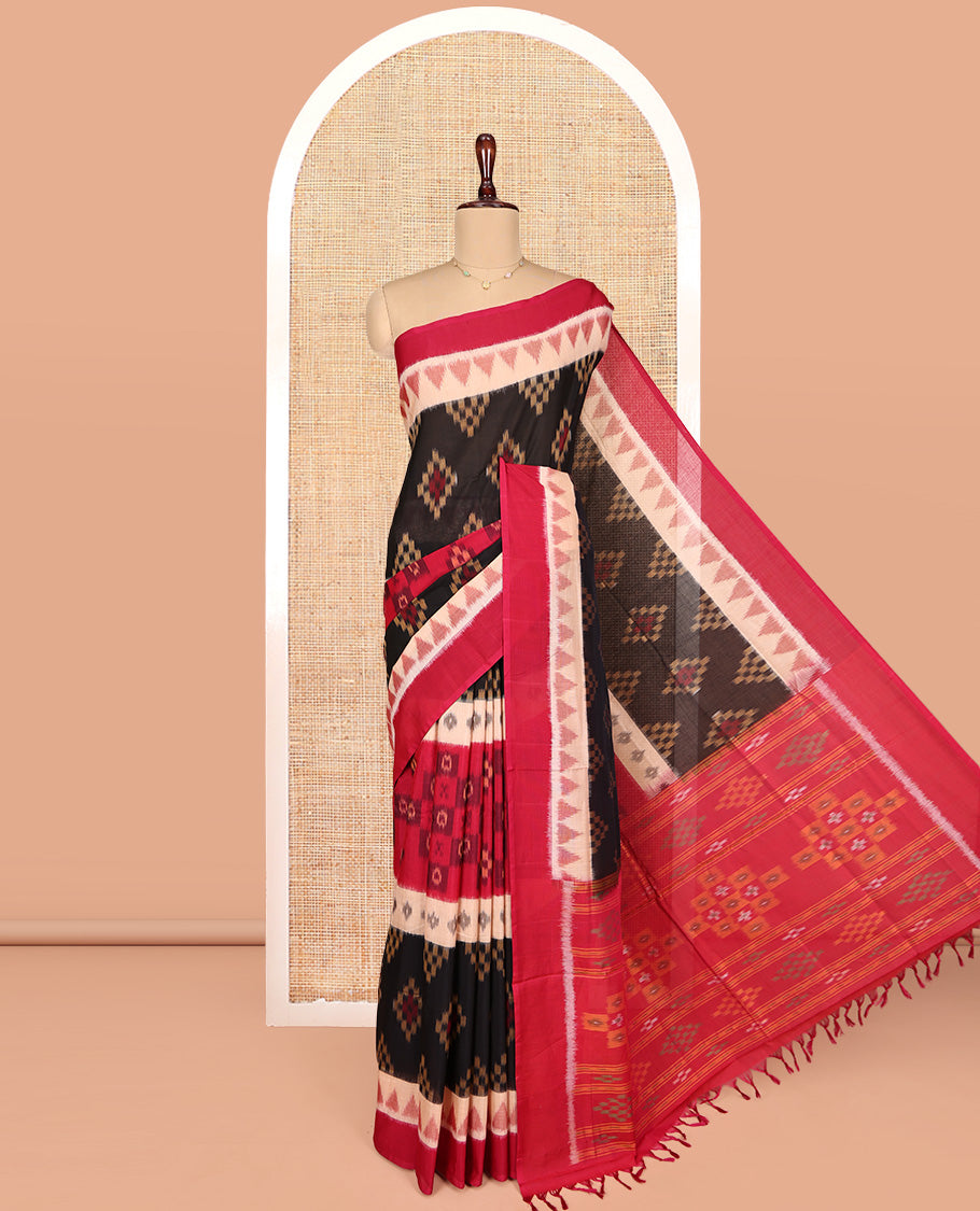 Black Ikkat Cotton Saree, Ornamented with Ikkat-style Buttas All Over Its Body, Complemented by a Contrast Temple Border, Pallu of Geometric Patterns, and Paired with a Contrast Blouse