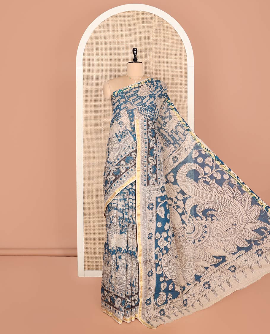 Blue Machine-Printed Kalamkari Cotton Saree Features Human Motifs, a Piping Border, Pallu of Peacocks, and a Matching Blouse