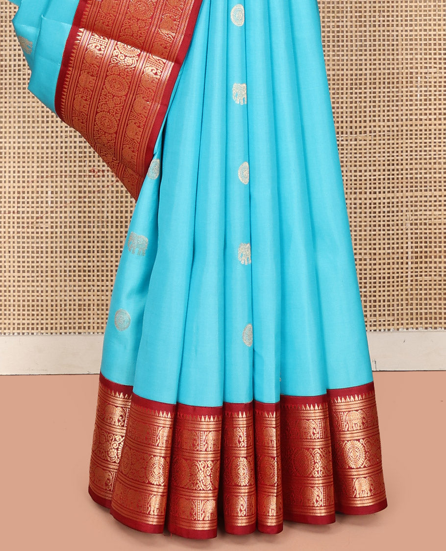 Blue Vasundhara Silk Saree, Embellished with Mayil and Yaanai Buttas Across Its Body, Complemented by a Contrast Korvai Border of Rekku, Banaras, Yaanai, and Chakram Designs, Gleaming Jaal Pallu, and Paired with a Contrast Blouse