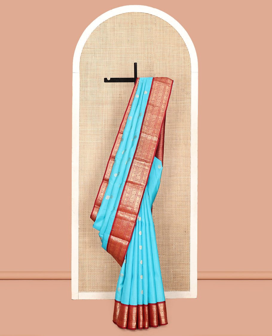 Blue Vasundhara Silk Saree, Embellished with Mayil and Yaanai Buttas Across Its Body, Complemented by a Contrast Korvai Border of Rekku, Banaras, Yaanai, and Chakram Designs, Gleaming Jaal Pallu, and Paired with a Contrast Blouse