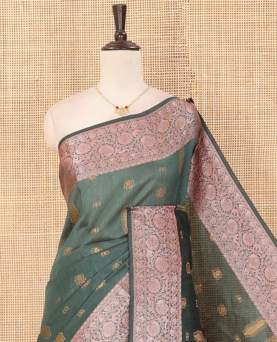 Green buttas dupion saree, floral creeper zari design border, and plain pallu flanked by floral creeper designs