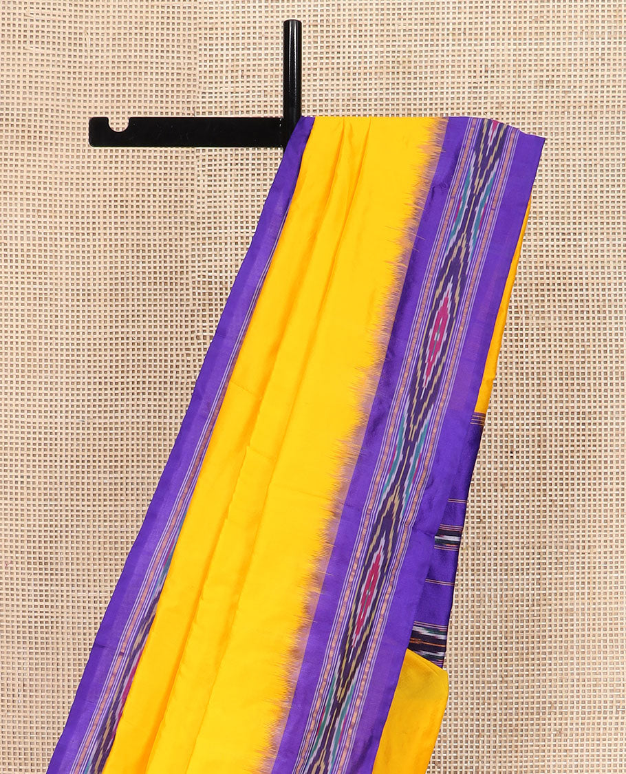 Bright Yellow Plain Ikkat Silk Saree with a Contrast Violet Border Dazzled by a Hazy Ikkat Weave, Featuring a Pallu Flanked by Stripes and Ikkat Texture