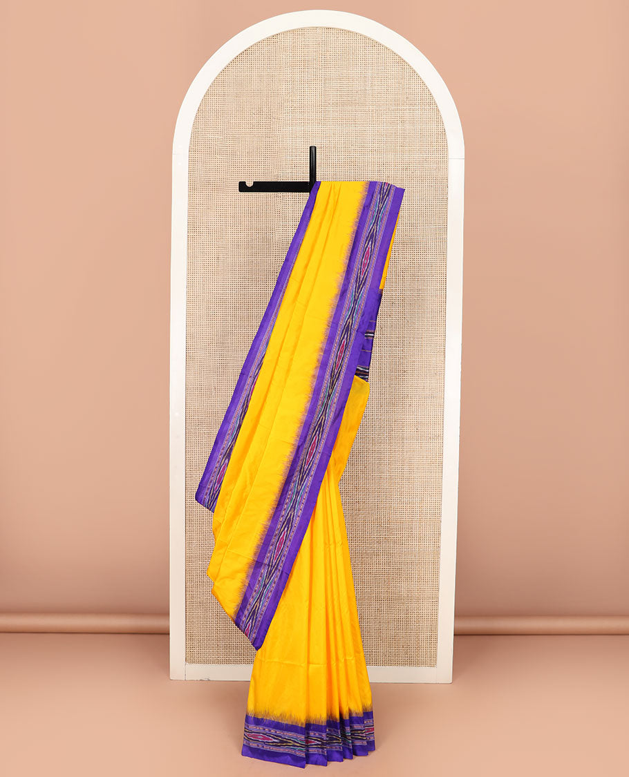 Bright Yellow Plain Ikkat Silk Saree with a Contrast Violet Border Dazzled by a Hazy Ikkat Weave, Featuring a Pallu Flanked by Stripes and Ikkat Texture