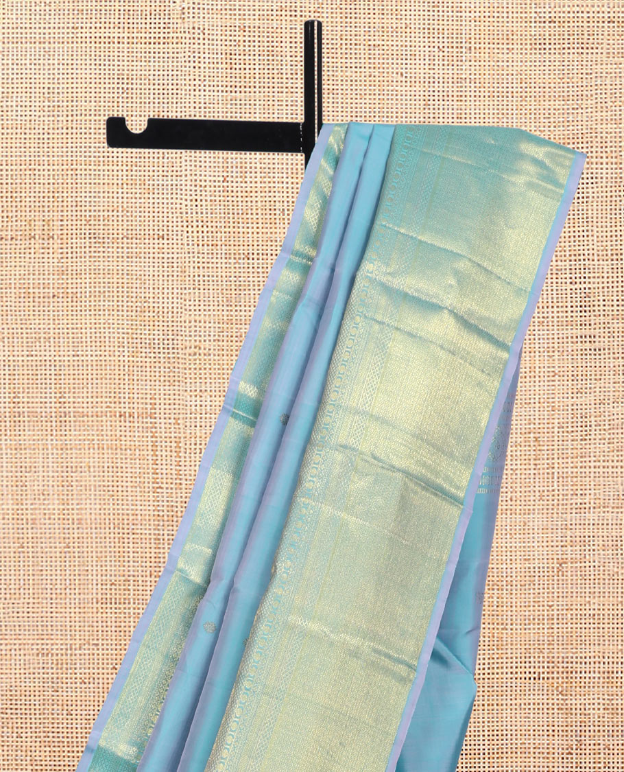 Blue Kanchipuram Silk Saree, Sparsely Woven with Zari Buttas, Highlighted by Zari Border of Manga, Neli, Mayil Kann, Kamalam, Poun, and Jaal Design, Zari Design Pallu, and a Matching Blouse