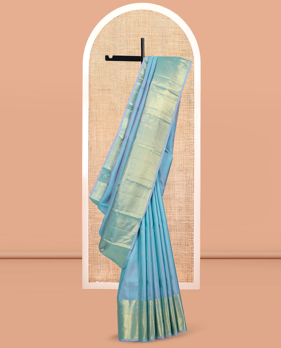 Blue Kanchipuram Silk Saree, Sparsely Woven with Zari Buttas, Highlighted by Zari Border of Manga, Neli, Mayil Kann, Kamalam, Poun, and Jaal Design, Zari Design Pallu, and a Matching Blouse