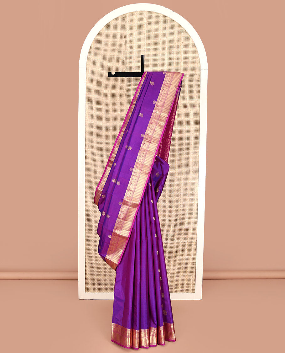 Purple Kanchipuram Silk Saree, Detailed with Chakram and Iruthalai Pakshi Buttas All Over Its Body, Complemented by a Contrast Border of Salngai, Muthu, Neli, Manga, and Kathir Designs, Intricately Designed Pallu, and Paired with a Contrast Blouse