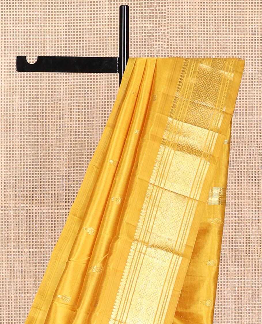 Mustard buttas kancheepuram silk saree with contrast border of thilakam mokku, banaras, muthu,checked design & zari design pallu