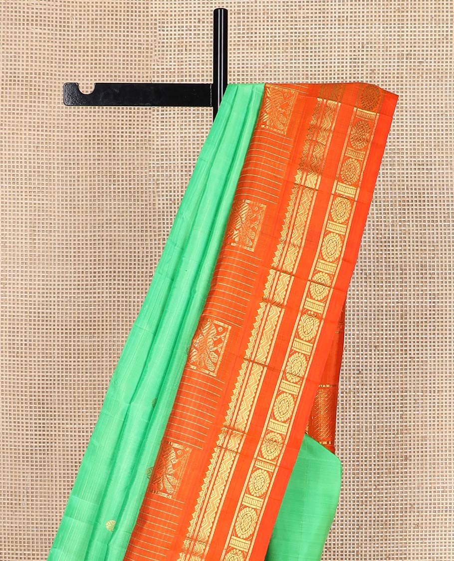 Green zari buttas silk saree, contrast one-sided temple rettai pettu border of salangai,banaras,rettai neli & chakram & intricate pallu
