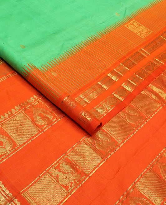 Green zari buttas silk saree, contrast one-sided temple rettai pettu border of salangai,banaras,rettai neli & chakram & intricate pallu