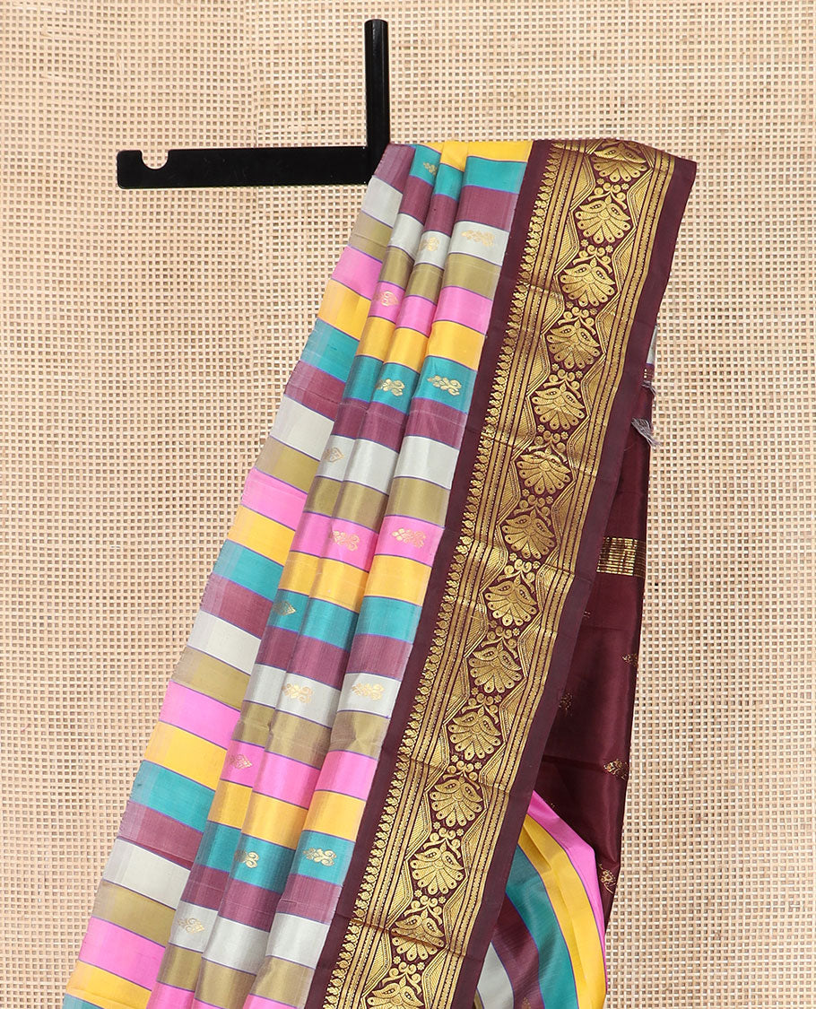 Multi-Color Kanchipuram Silk Saree Majestically Detailed with Stripes and Zari Buttas, Highlighted by Contrast One-Sided Korvai Border of Traditional Zari Designs, Grandly Woven Pallu of Zari Design, and Comes Without a Blouse