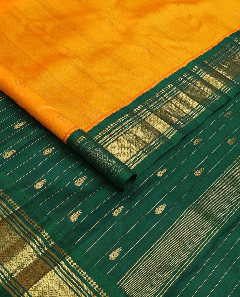 Yellow zari buttas Kanchipuram silk saree, contrast one-sided korvai border of panner, sombu, banaras, muthu, and mayil kann and zari design pallu
