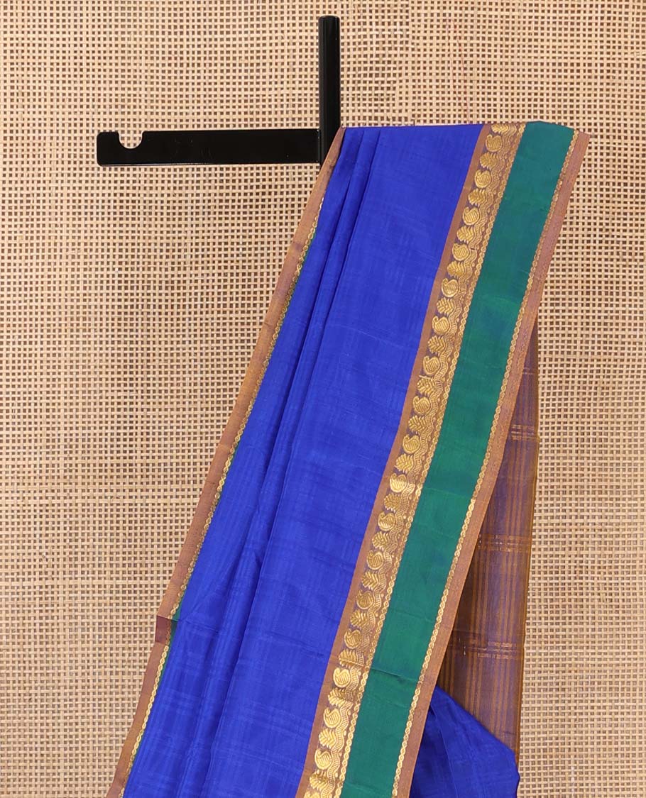 Royal blue checked Kanchipuram silk saree, contrast border of manga, neli, and diamond designs, and striped pallu