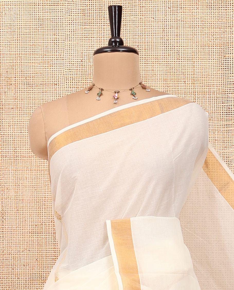 Cream Kerala Cotton Saree, Enriched with Zari Stripes All Over Its Body, a Subtle Bavanji Border, Pallu Features Peacock Designs, and Paired with a Matching Blouse