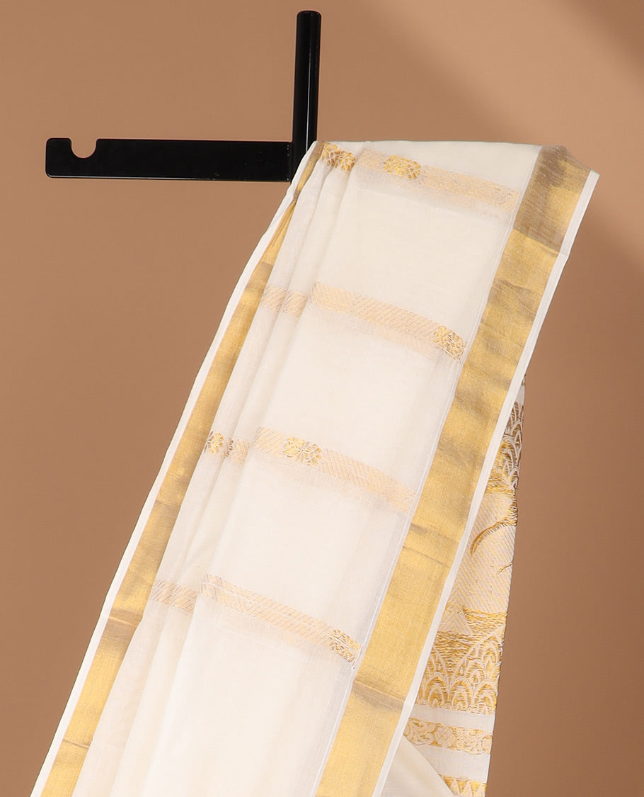 Cream kerala saree with zari designs, zari border & pallu with traditional designs