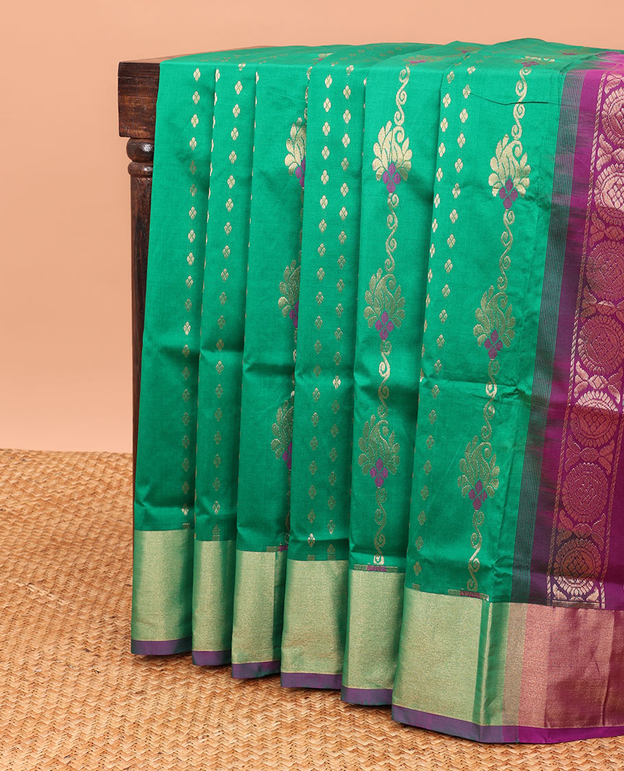Green kupadam cotton saree with buttas, plain border & contrast pallu of ogee patterns