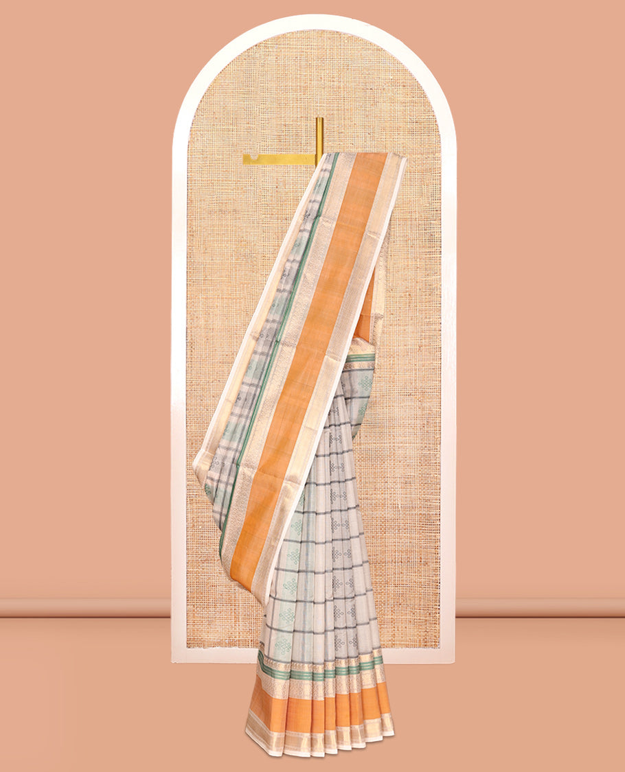 Cream Buttas Enclosed Checked Kuppadam Silk Saree, a Contrast Double-Pet Border, Grand Pallu, and a Matching Blouse