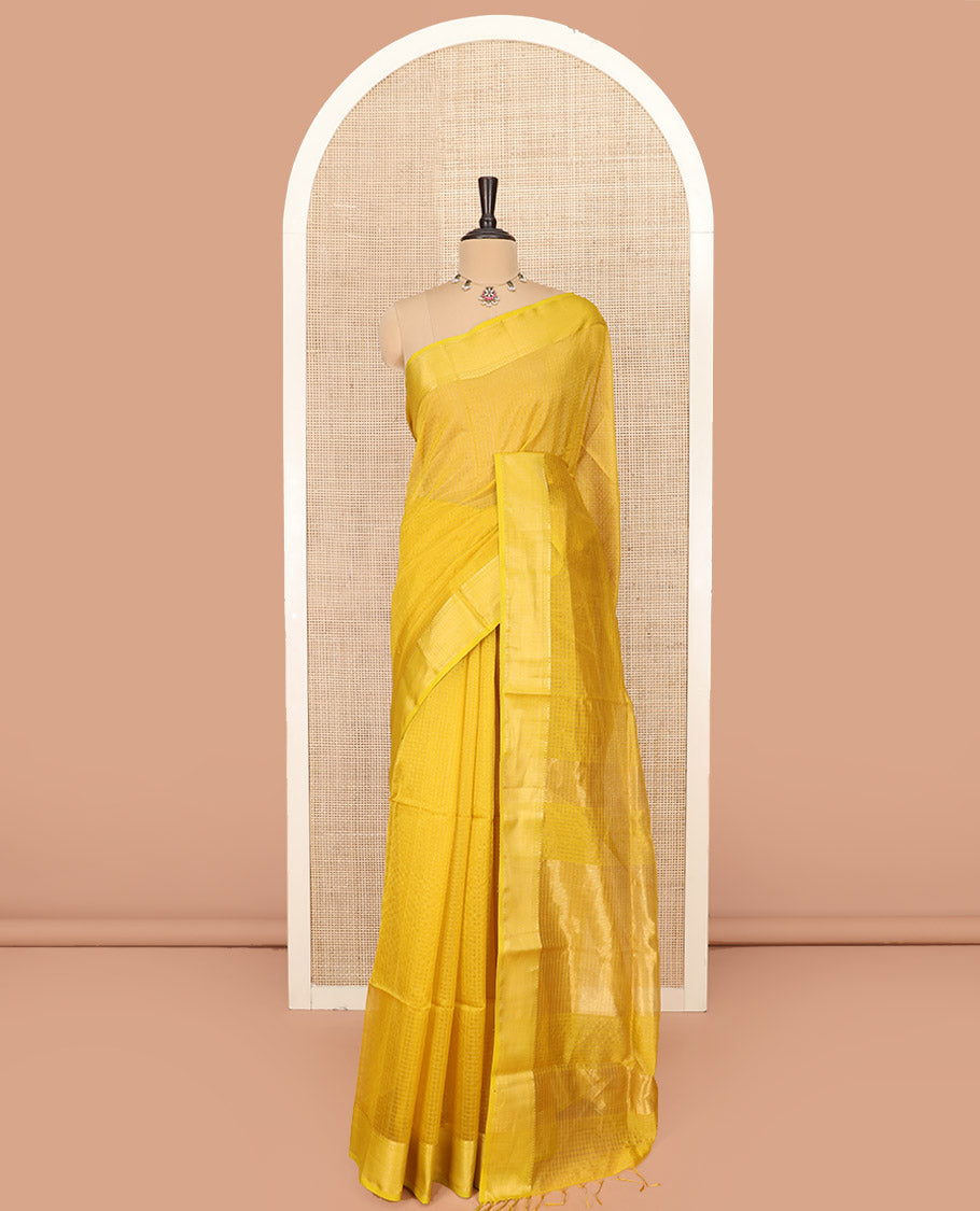 Yellow Maheshwari Cotton Saree Sparsely Sparkled with Zari Checks, Subtly Woven with a Traditional Zari Design Border, Pallu Gleamed Up with Zari Stripes, and Paired with a Matching Blouse