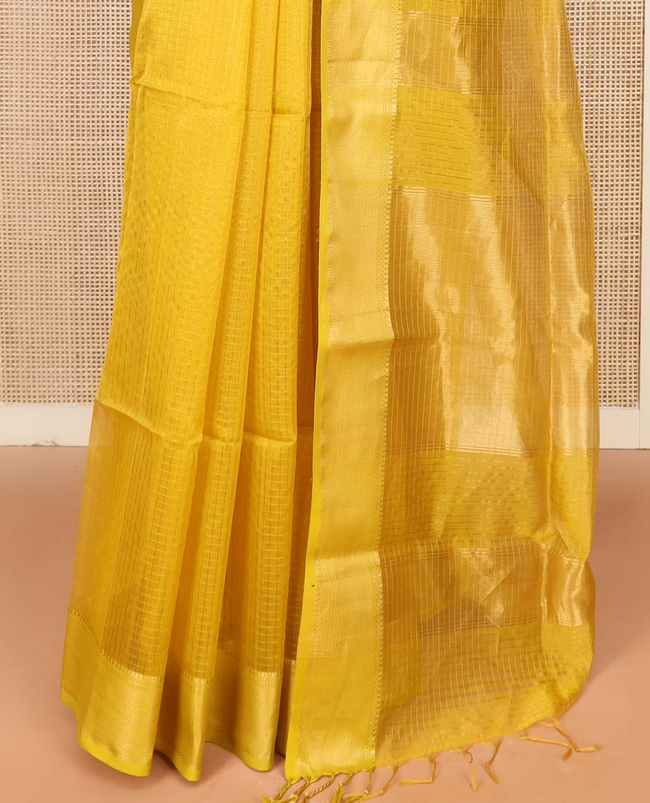 Yellow Maheshwari Cotton Saree Sparsely Sparkled with Zari Checks, Subtly Woven with a Traditional Zari Design Border, Pallu Gleamed Up with Zari Stripes, and Paired with a Matching Blouse