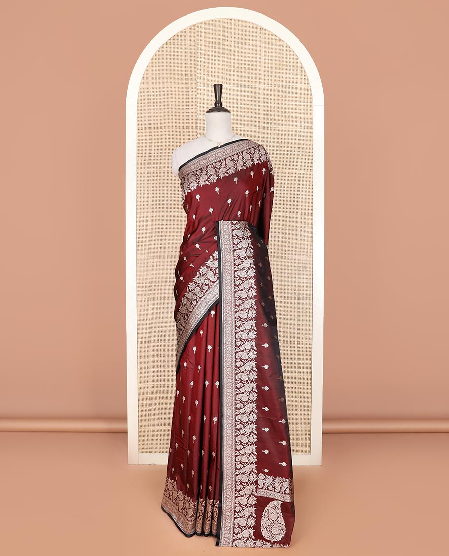 Maroon buttas mushru silk saree, self-border of floral-paisley creeper designs, and paisley design pallu