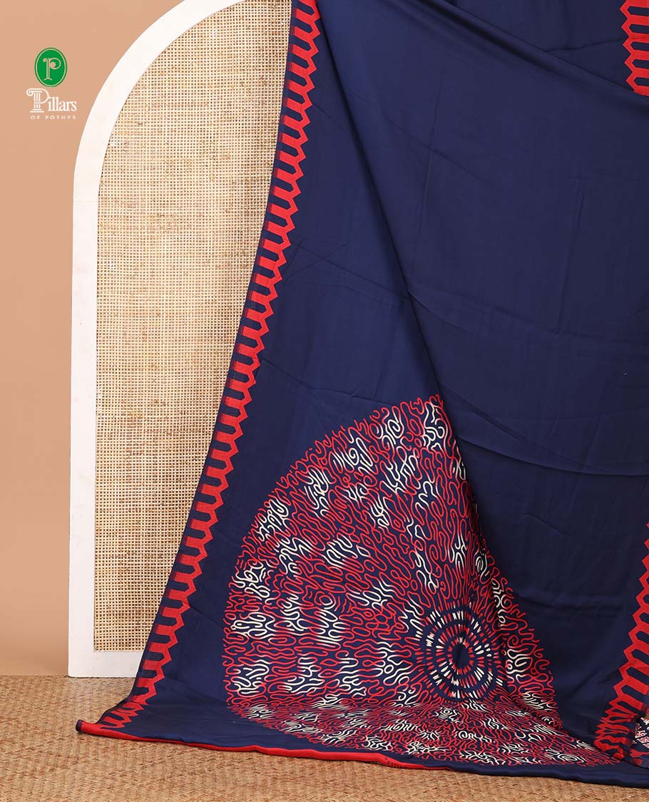 Navy blue plain gajji silk saree features a temple-printed border, a circular-shaped vine-patterned pallu, and a unique motif-printed blouse