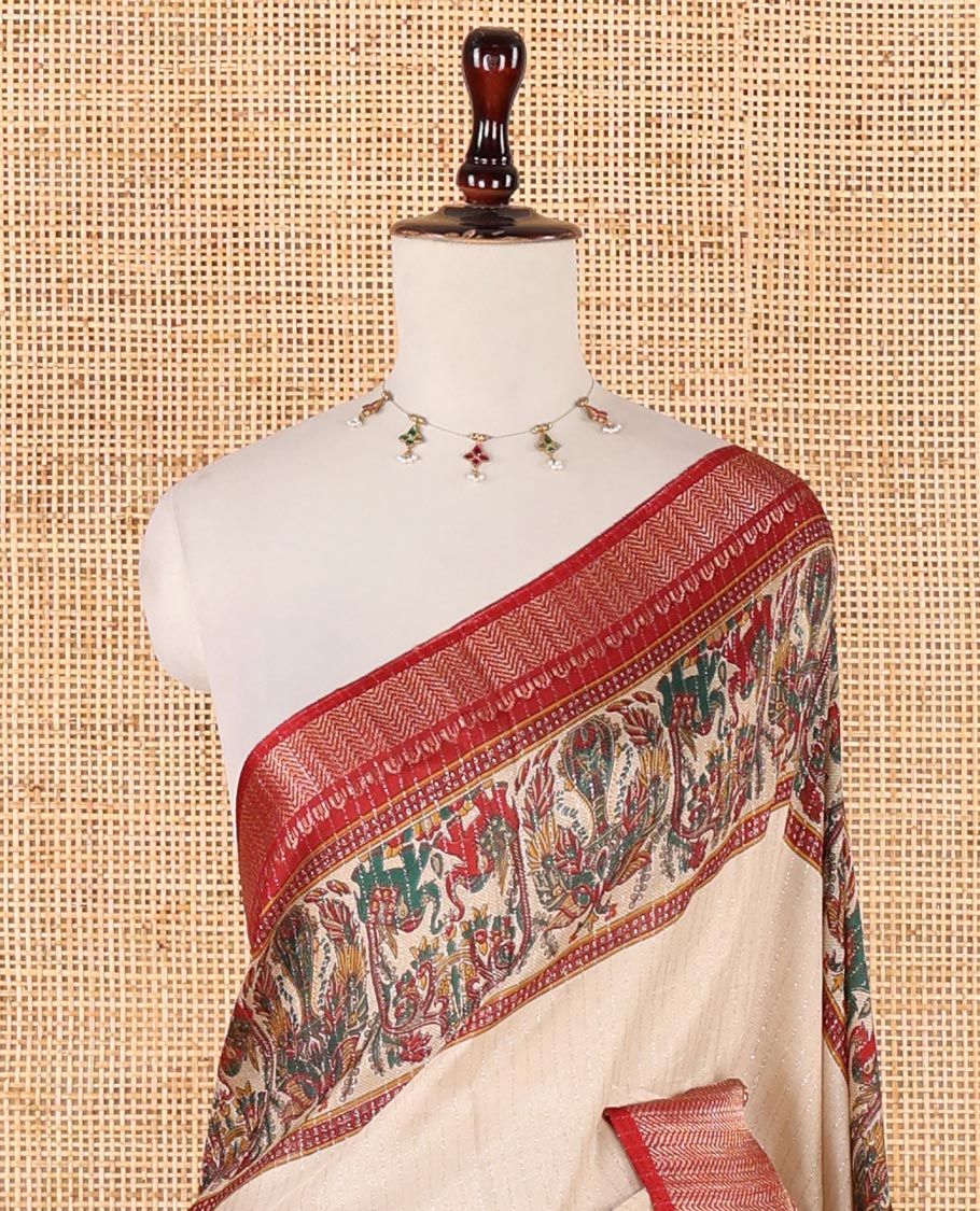 Cream zari striped dola silksaree,contrast red zari border & pallu of kalamkari animal print, ajrakh printed blouse