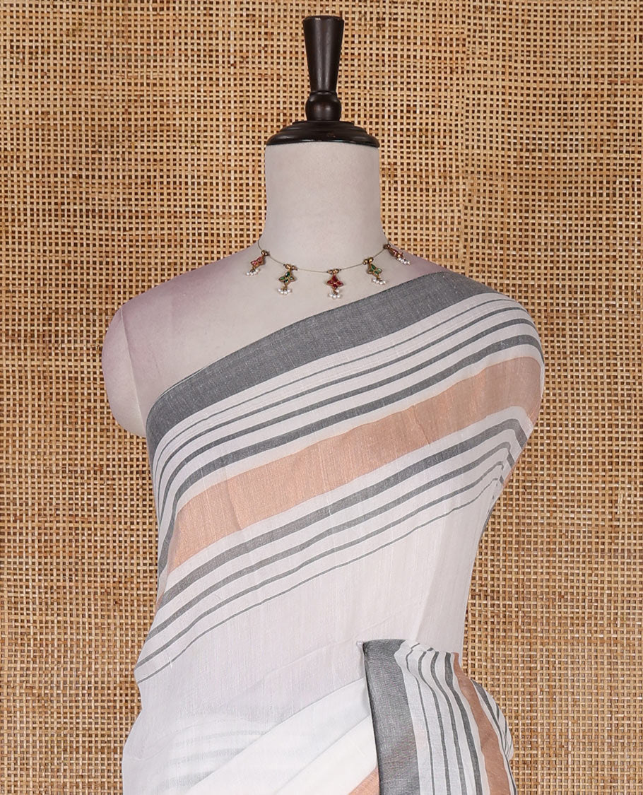 Cream-grey plain design mul mul cotton saree, contrast copper zari horizontally striped border, plain pallu, and plain blouse