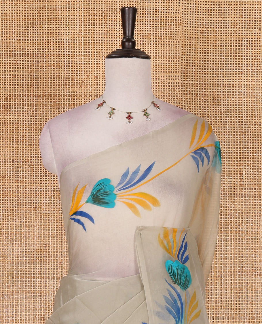 Borderless pista green floral motifs hand brush painted semi-organza saree comes with tasseled pallu and without blouse