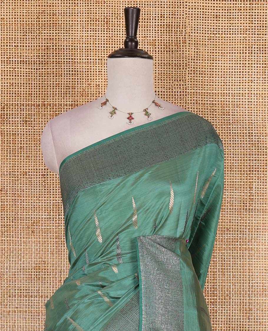 Green buttas woven semi-tussar saree, zari border, geometric patterned pallu, and a matching blouse