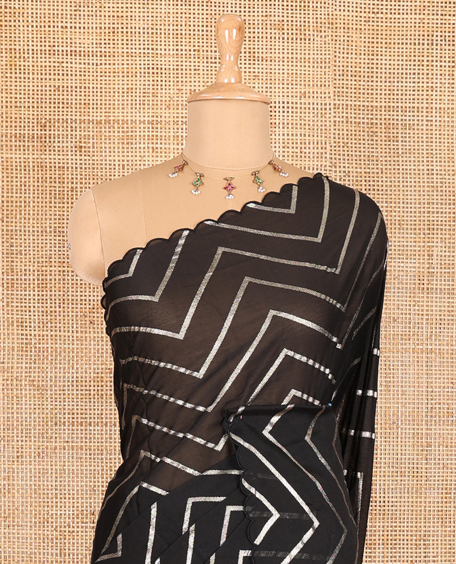 Borderless black zig-zag stripes gold foil printed, scallop-edged rangoli chiffon saree with a matching bandhani dotted blouse