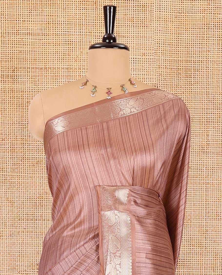 Brown striped semi-tussar saree, traditional zari border of floral creeper designs, contrast pallu of Pichwai cow print, and contrast Pichwai cow printed blouse