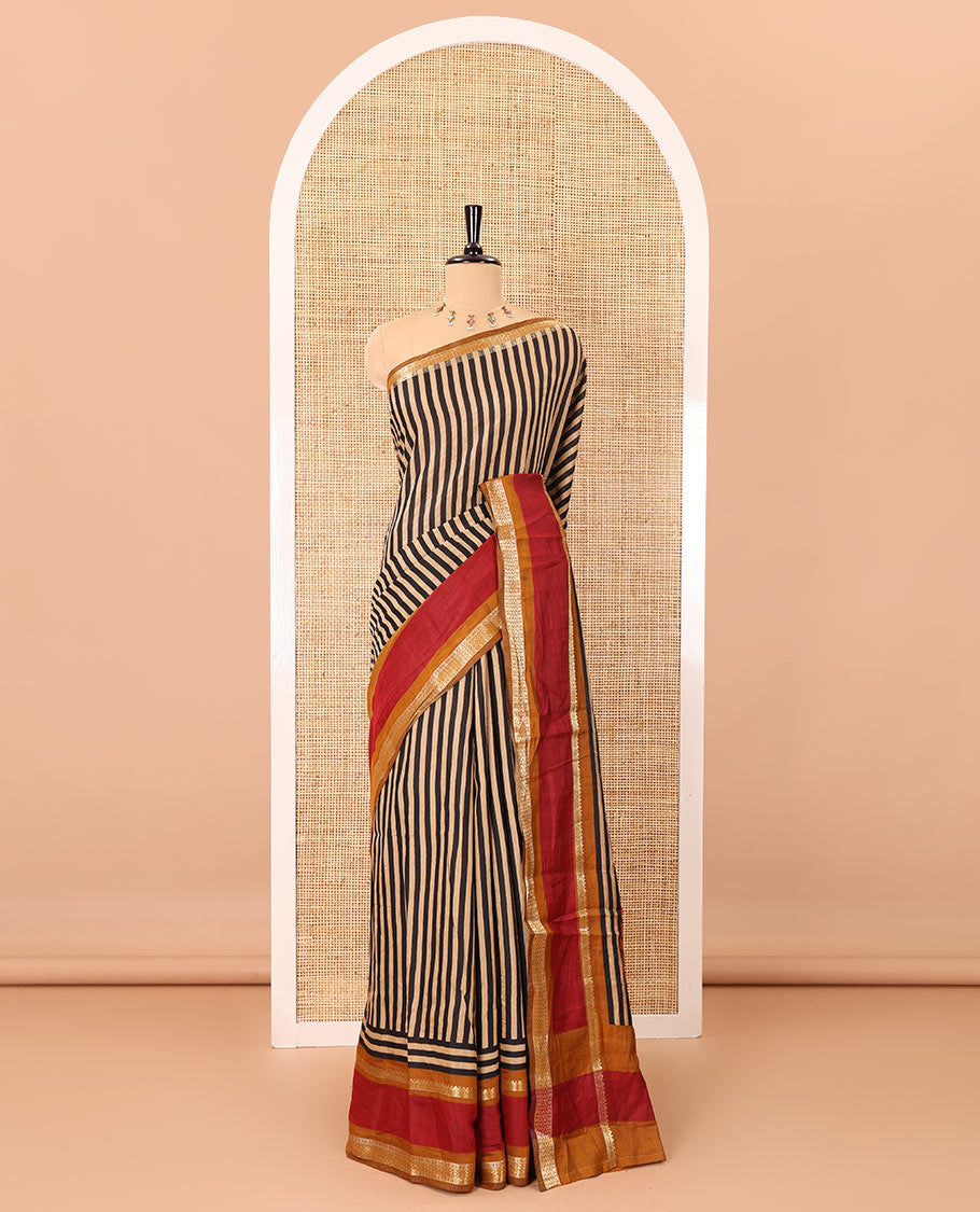 Black vertically striped muslin silk saree, contrast zari rettai pettu border, kalamkari floral vine printed pallu, and a contrast plain blouse