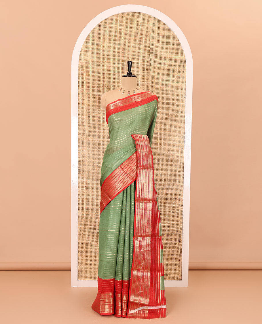 Green horizontal zari striped moss chiffon saree, contrast traditional zari border, striped pallu, and a contrast zari design blouse