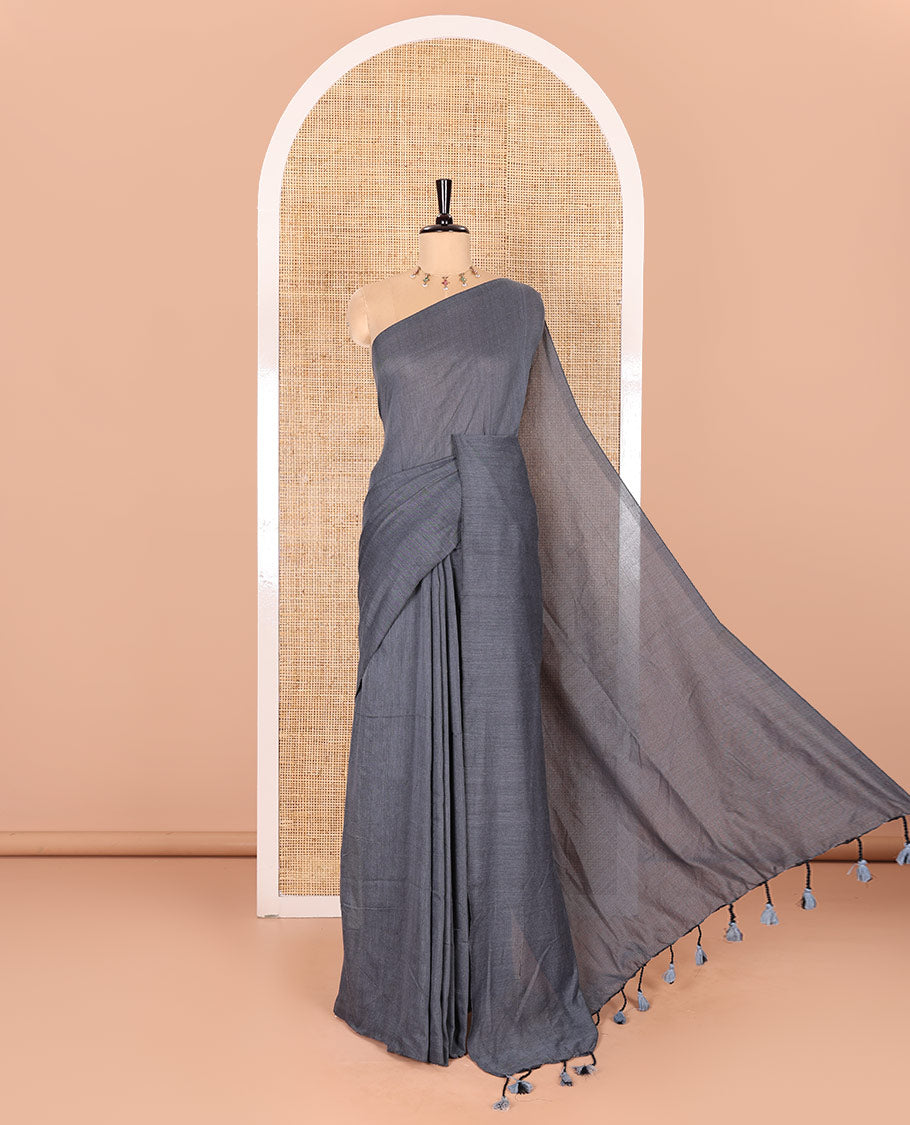 Borderless Elephant Grey Plain Khadi Mul Cotton Saree Featuring a Self Pallu with Tassels, Paired with a Matching Plain Blouse