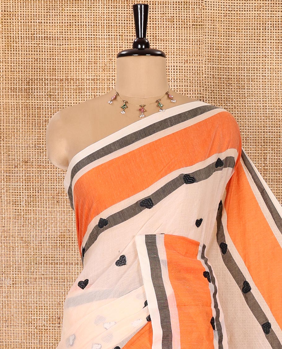 Peach Khadi Mul Cotton Saree Mesmerized with Heart Motifs Embroidery All Over Its Body, Complemented by a Contrast Plain Border, Pallu Steeped with Heart Motifs Embroidery, and Paired with a Matching Blouse