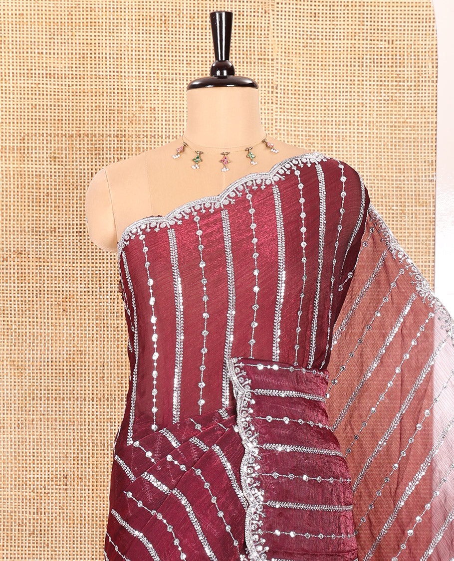 Purple Fendy Chiffon Saree Highlighted with Sequins and Thread Stripes Embroidery, Scallop Embroidered Border, Elegantly Embroidered Pallu, and Paired with a Matching Blouse