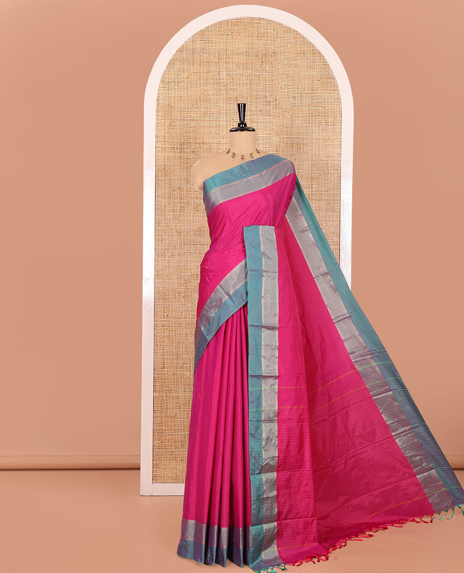 Rani Pink Plain Semi-Soft Silk Saree, Complemented by a Contrast Silver Zari Striped Border, Sparsely Striped Pallu, and Paired with a Matching Blouse