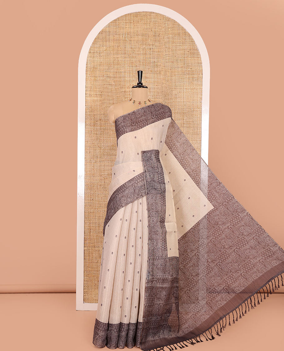 Chikku and Black Tissue Linen Saree, Delicately Printed with Floral Motifs on Its Body, Complemented by a Contrast Border of Paisley Designs, Pallu Steeped with Paisley Designs, and Paired with a Contrast Blouse