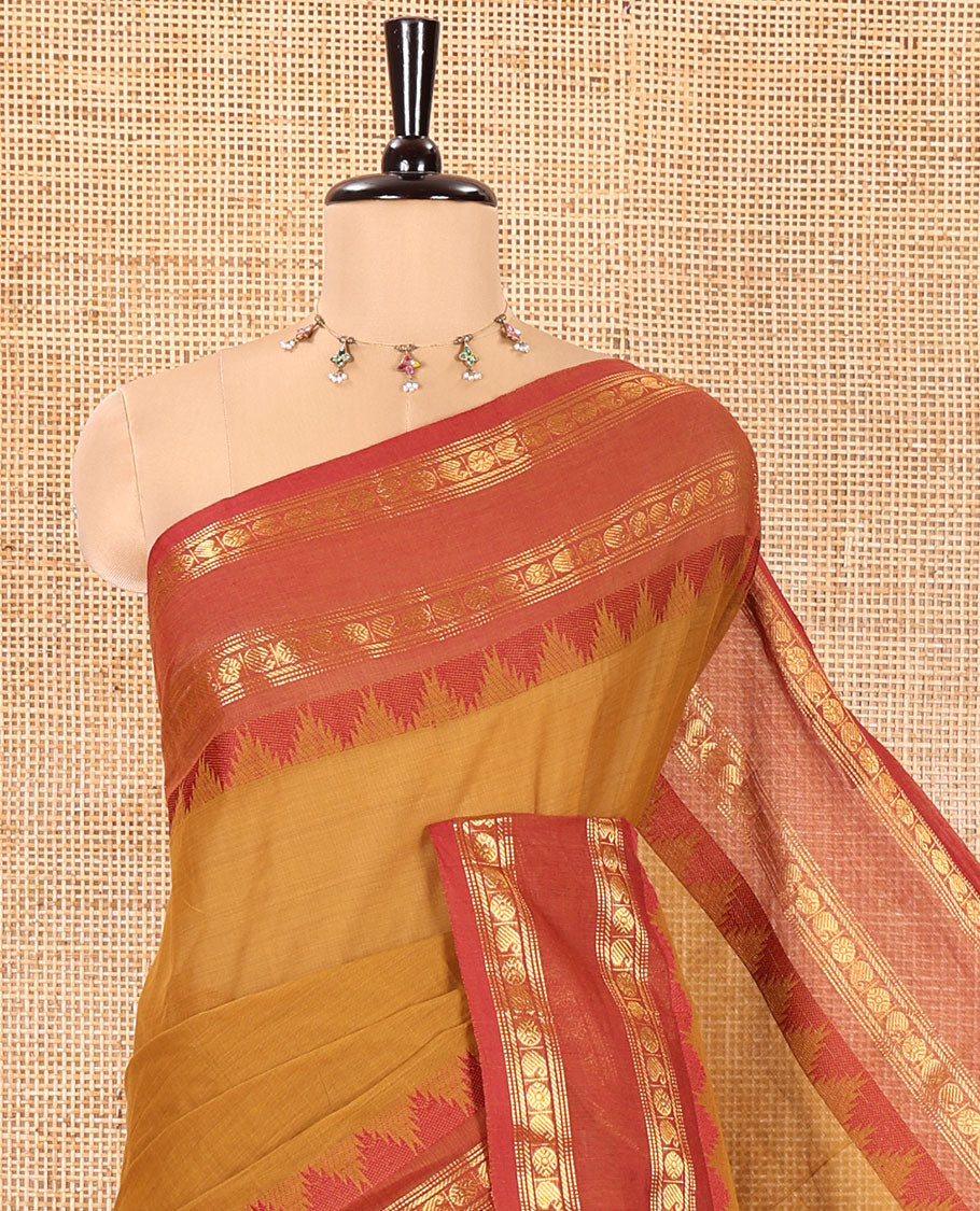 Mustard Chettinad Cotton Saree, Subtly Sparkled with Paisley Buttas All Over Its Body, Complemented by a Contrast Temple Rettai Pettu Traditional Zari Design Border, Pallu of Stripes and Buttas, and Paired with a Matching Blouse