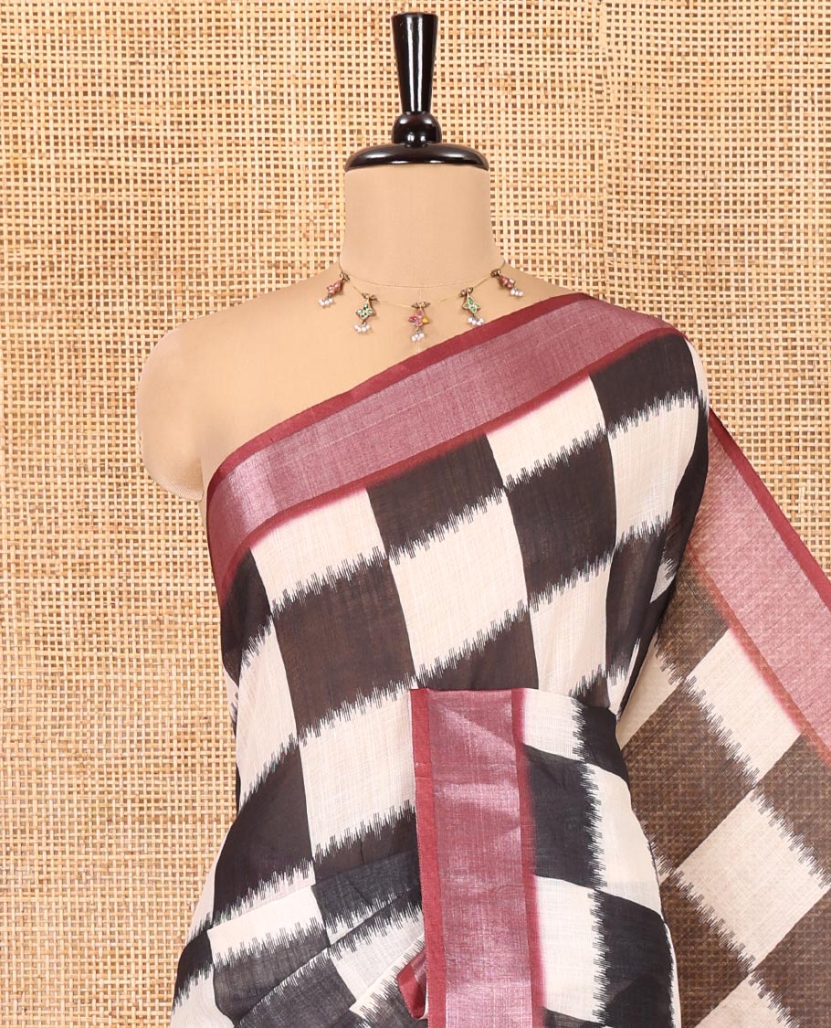 Black and White Linen Cotton Saree, Uniquely Printed with Chess-Style Checked Design on Its Body, Complemented by a Contrast Zari Border, Chevron Design Pallu, and Paired with a Contrast Blouse