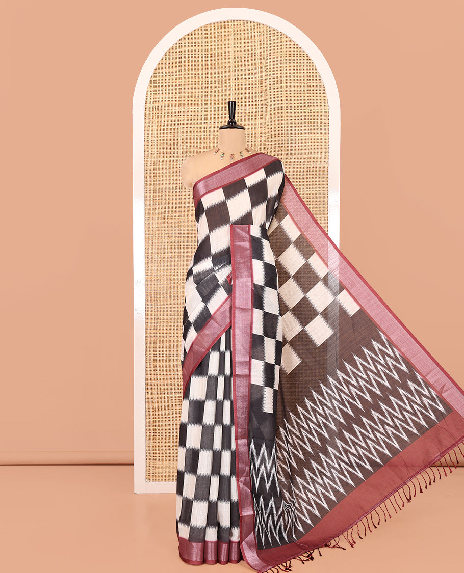 Black and White Linen Cotton Saree, Uniquely Printed with Chess-Style Checked Design on Its Body, Complemented by a Contrast Zari Border, Chevron Design Pallu, and Paired with a Contrast Blouse