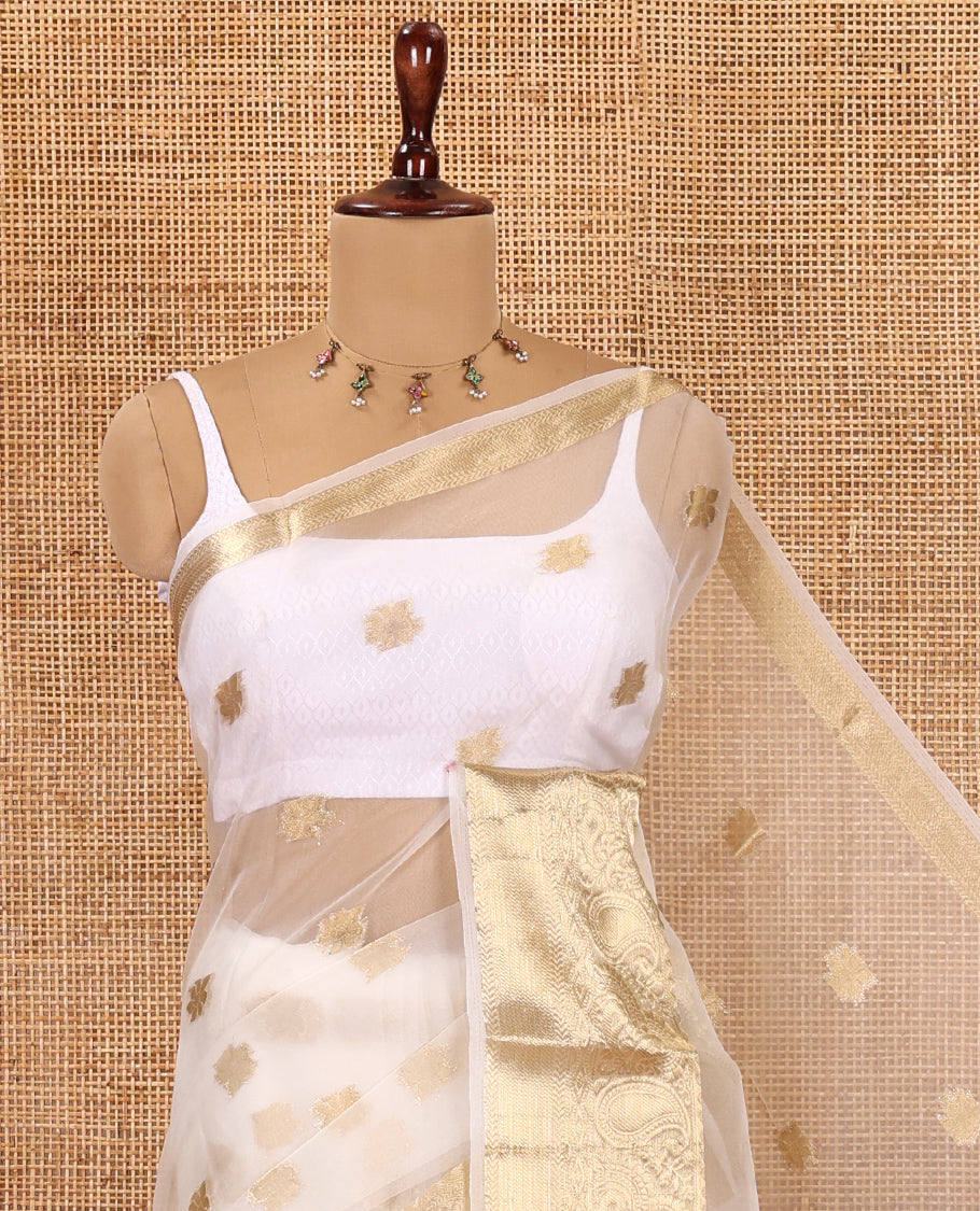 Cream Semi-Organza Saree, Masterfully Woven with Zari Buttas, Highlighted by a Zari Paisley Border, and a Matching Blouse