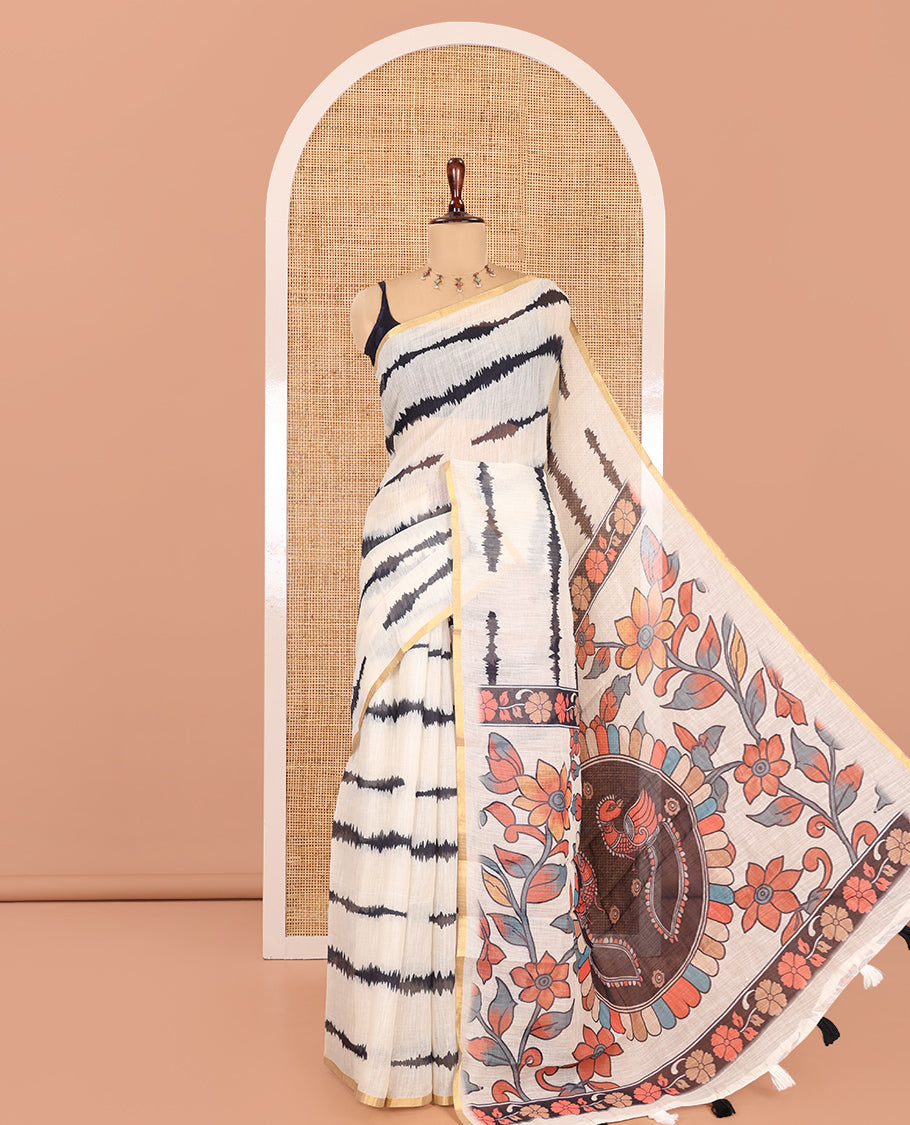 Cream Linen Cotton Saree, Adorned with Shibori Print, a Zari Piping Border, Floral-Peacock Motif Printed Pallu, and Matching Blouse