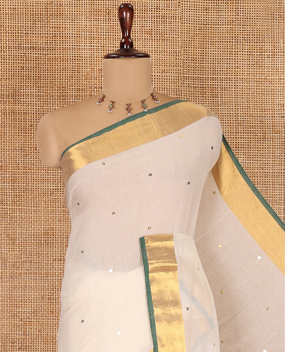 Cream Khadi Mul Cotton Saree, Gleamed Up with Sequined Work, Contrast Gold Zari Border, a Self-Pallu, and a Matching Blouse