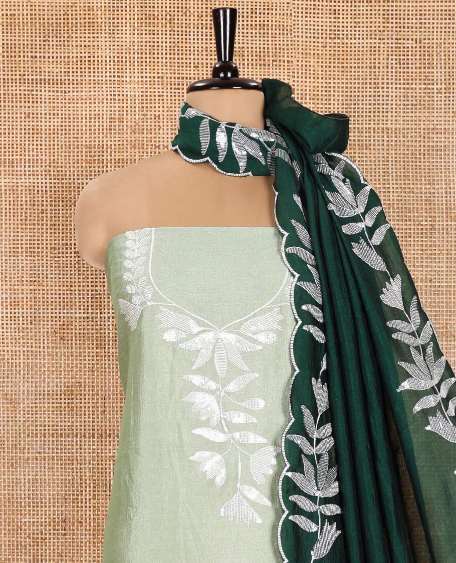 Pista Green Material Churidar Set, Detailed with Floral Motifs Sequins-Thread Embroidered on Its Vichitra Silk Top, Comes with a Contrast Santoon Bottom, and Paired with a Vichitra Silk Floral Embroidered Scallop Dupatta
