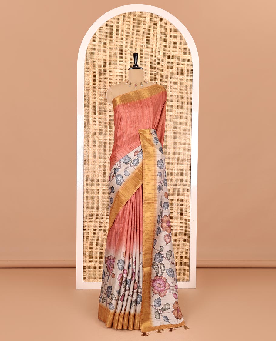 Orange plain fancy tussar saree, contrast floral printed border, floral vine printed pallu, and a contrast plain blouse
