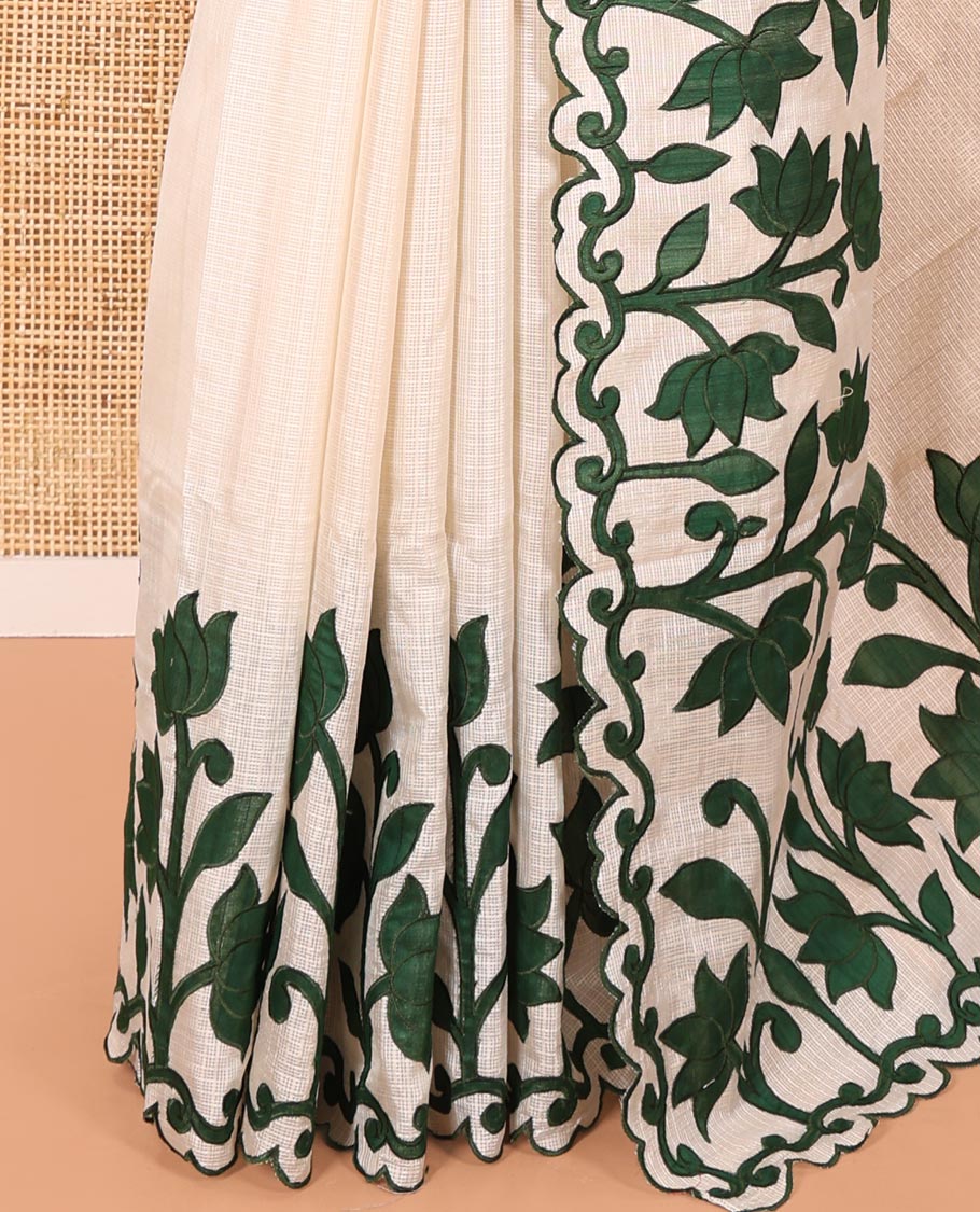 Cream and Green Plain Fancy Kota Silk Saree Highlighted with Lotus Floral Applique Embroidered Scallop Border, Lotus Motifs Applique Embroidered Pallu, and a Contrast Plain Blouse